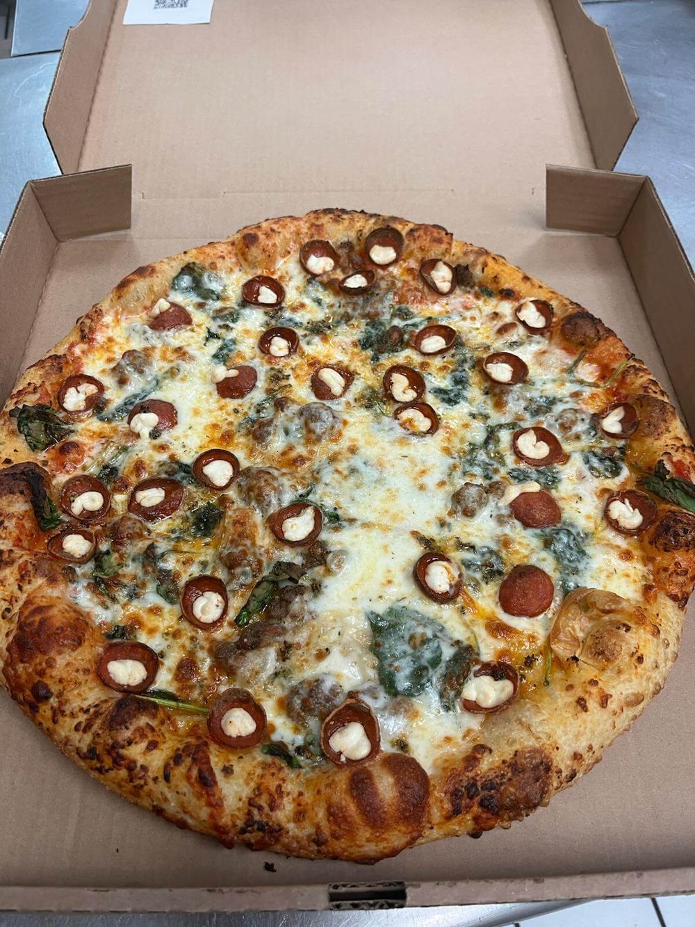 The Amore: spinach, cup-and-char pepperoni, ricotta and meatball pizza