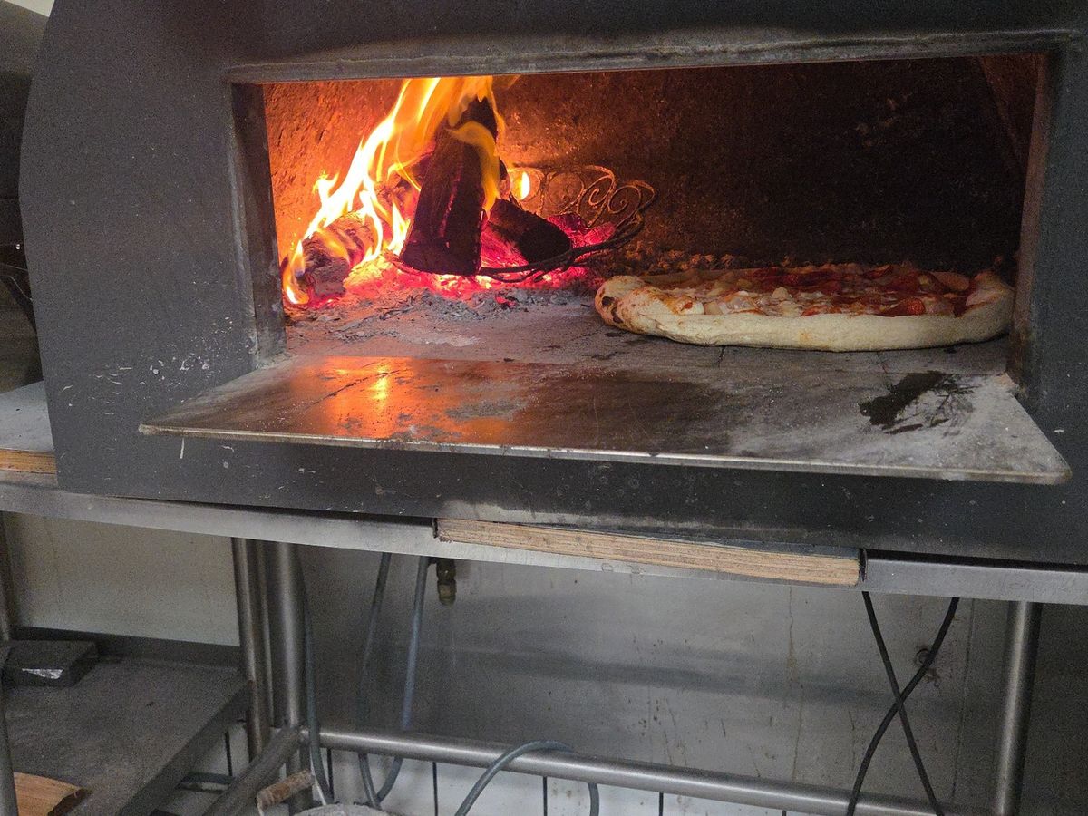 Fresh Out of the Oven — Straight off the stone at Rihana's Pizza & Wings, North Phoenix