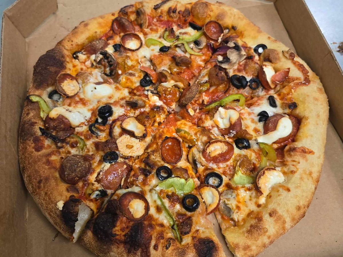 The Italian Supreme — Loaded with the works, wood-fired at Rihana's Pizza & Wings, North Phoenix