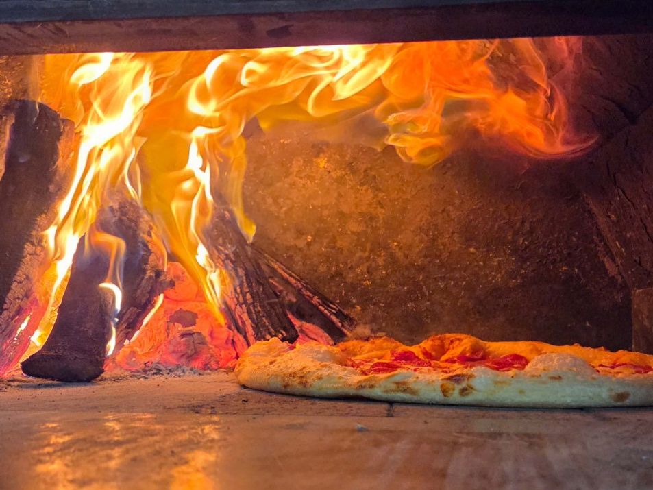 In the Fire — 800°F, about 90 seconds at Rihana's Pizza & Wings, North Phoenix
