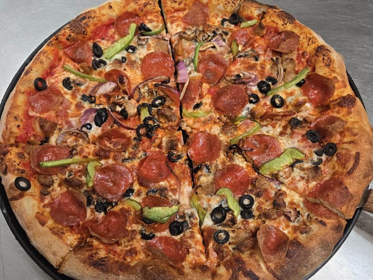 The Supreme — Pepperoni · sausage · peppers · onion · olives · mushrooms at Rihana's Pizza & Wings, North Phoenix