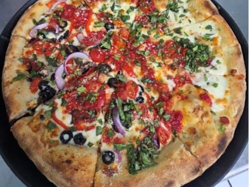 Veggie — Crushed tomato · peppers · onion · olives · fresh herbs at Rihana's Pizza & Wings, North Phoenix
