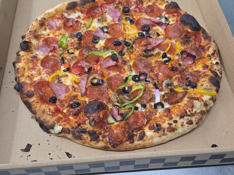 The Supreme — Ham · pepperoni · peppers · olives at Rihana's Pizza & Wings, North Phoenix
