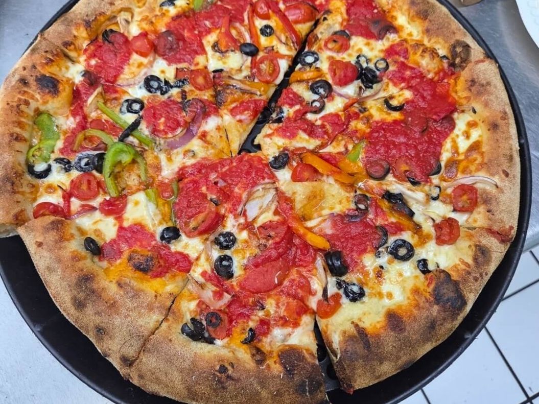 Crushed Tomato & Peppers — Chunky tomato · roasted peppers · olives at Rihana's Pizza & Wings, North Phoenix