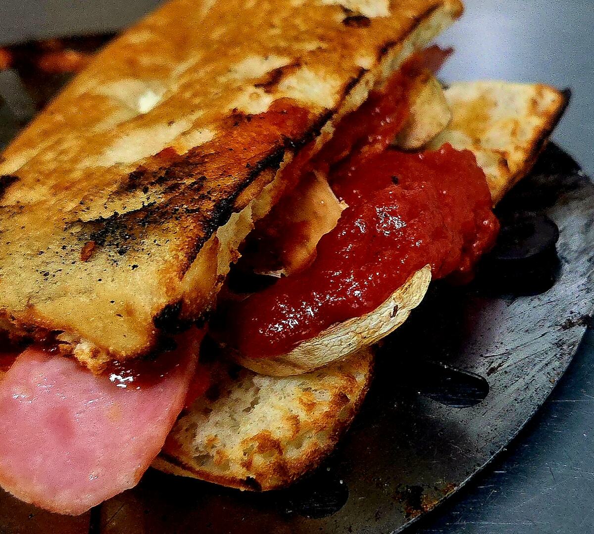 Rihana Roll with ham and red sauce on toasted bread